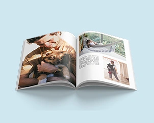 Open softcover photo book with holiday pictures